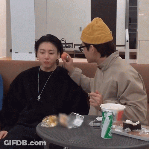 Two Men At Table With Sprite Can GIF