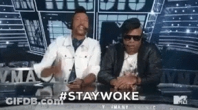 Two Men At Table With #Staywoke GIF