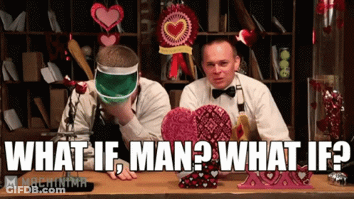 Two Men At Table With Valentine Decorations Saying What If Man What If GIF