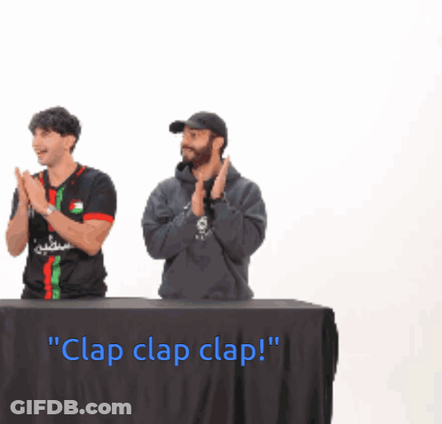Two Men Behind Table Saying Clap Clap Clap GIF