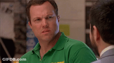 Two Men Beside Monitor In Campsters Store GIF