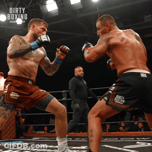 Two Men Boxing In Dirty Ring GIF