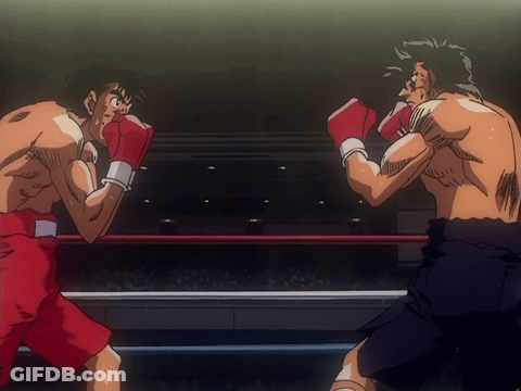 Two Men Boxing In Ring One In Red Shorts GIF