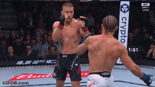 Two Men Boxing In Ring With Crypto Sign GIF