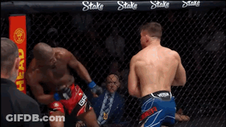 Two Men Boxing In Ring With Referee GIF