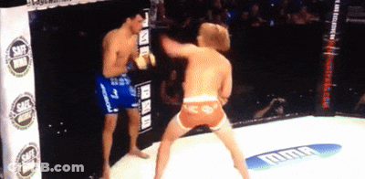 Two Men Boxing In Ring With UFC Banner GIF