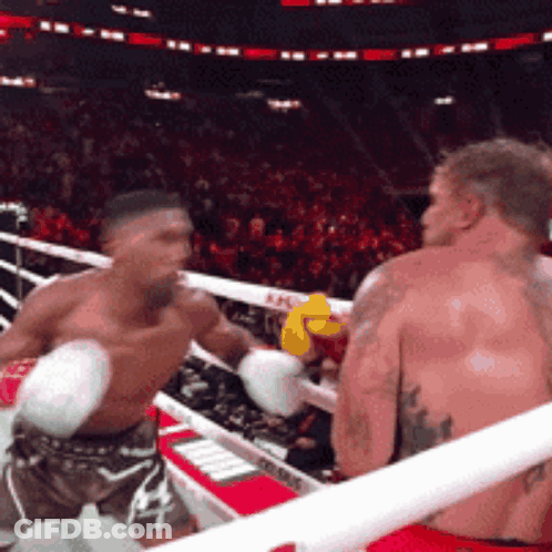 Two Men Boxing In Ring With Yellow Glove GIF