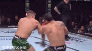 Two Men Boxing One In Green Shorts GIF