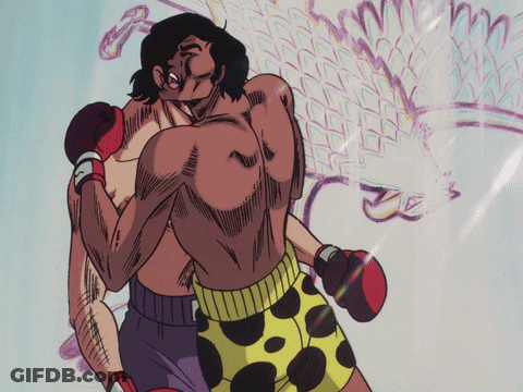 Two Men Boxing, One In Yellow Polka Dot Shorts GIF