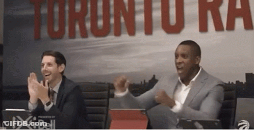 Two Men Clapping In Front Of Raptors Sign GIF