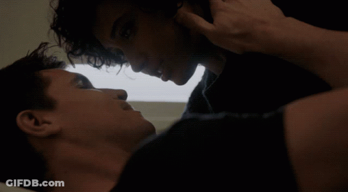 Two Men Close Up One Touching Other's Face GIF