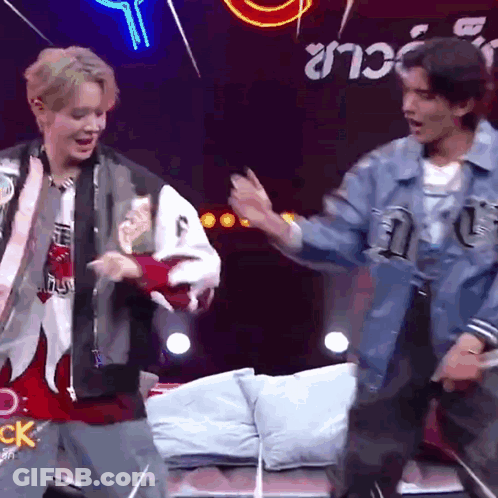 Two Men Dancing Before Neon CK Sign GIF