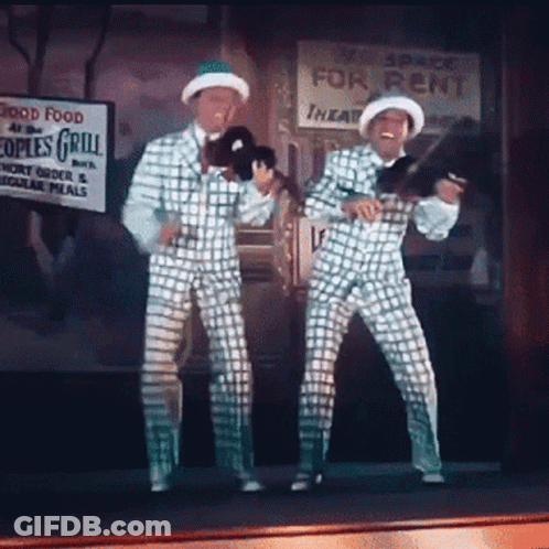 Two Men Dancing By Space For Rent Sign GIF