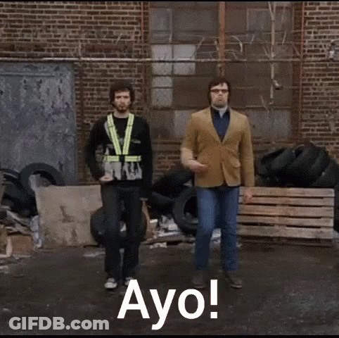 Two Men Dancing By Tire Pile Saying Ayo GIF