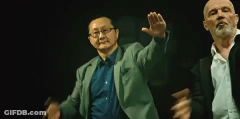 Two Men Dancing In Dark Room GIF