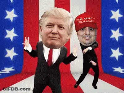 Two Men Dancing In Front Of American Flag, One Wearing Make America Great Again Hat GIF