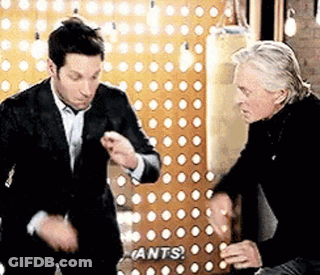 Two Men Dancing In Front Of Ants Wall GIF
