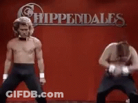 Two Men Dancing In Front Of Appendales Sign GIF