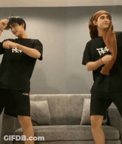 Two Men Dancing In Front Of Couch GIF