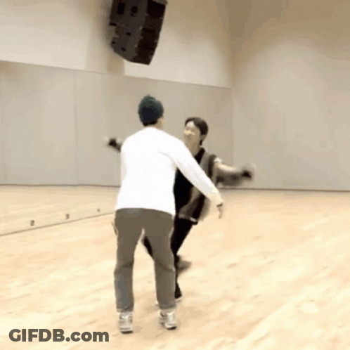Two Men Dancing In Front Of Mirror GIF