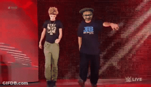 Two Men Dancing In Front Of Raw Sign GIF