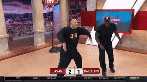 Two Men Dancing In Front Of Scoreboard Saying Lavar 21 Marcellus GIF