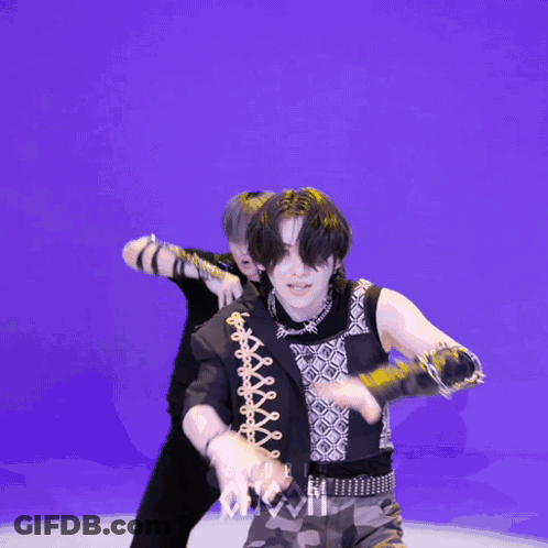 Two Men Dancing In Front Of Studio Chaos GIF