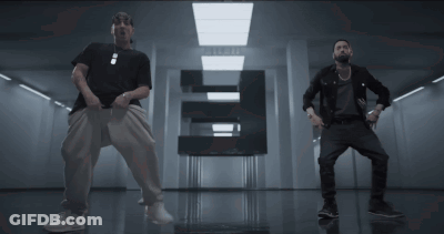 Two Men Dancing In Hallway With Letter E GIF