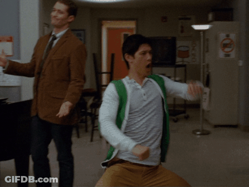 Two Men Dancing In Room With Recycle Sign GIF