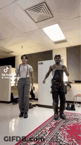 Two Men Dancing On Red Rug GIF