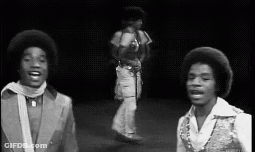 Two Men Dancing On Stage GIF