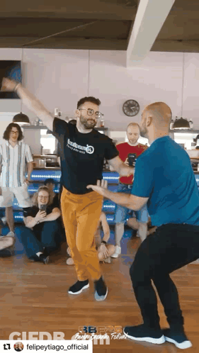 Two Men Dancing On Stage Felipe Y Tiago Rolerotation GIF
