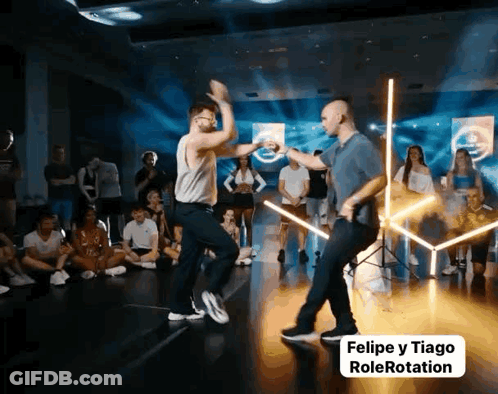 Two Men Dancing On Stage Felipe Y Tiago Rolerotation GIF