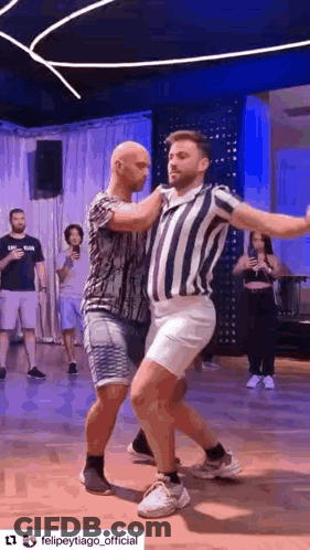 Two Men Dancing Together In Dance Studio GIF