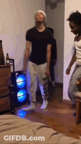 Two Men Dancing With Speaker GIF