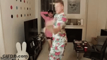 Two Men Dancing With Stuffed Bunny GIF
