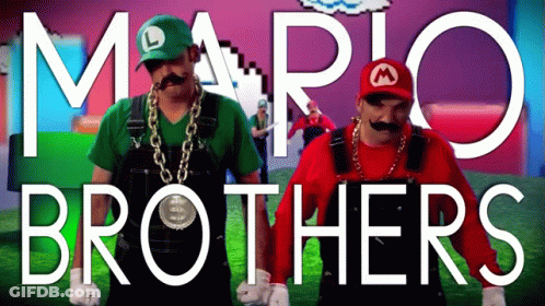 Two Men Dressed Up As Mario And Luigi Are Dancing GIF