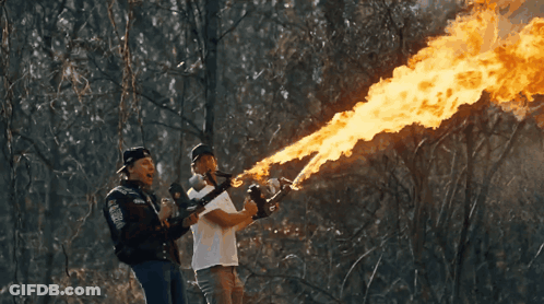 Two Men Drinking Fire-Breathing GIF