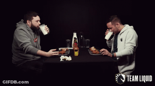 Two Men Drinking Milk And Eating Fried Chicken GIF