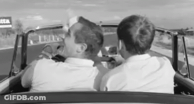 Two Men Driving Car On Highway GIF
