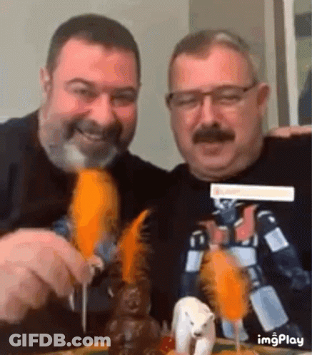Two Men Eating Carrots With Polar Bear GIF