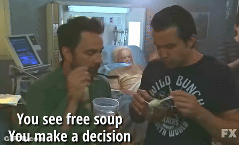 Two Men Eating Soup In Front Of Elderly Woman In Hospital Bed Saying You See Free Soup You Make A GIF