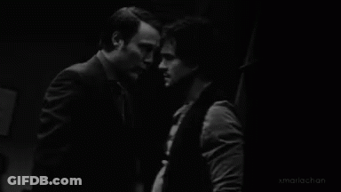 Two Men Face To Face Black And White GIF