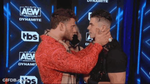 Two Men Facing Each Other AEW Dynamite Sign GIF