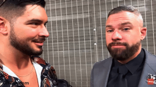 Two Men Facing Each Other With Pin Saying RN GIF