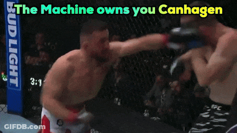 Two Men Fighting In A Ring Saying The Machine Owns You Canhagen GIF