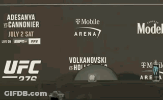 Two Men Fighting In Boxing Ring GIF