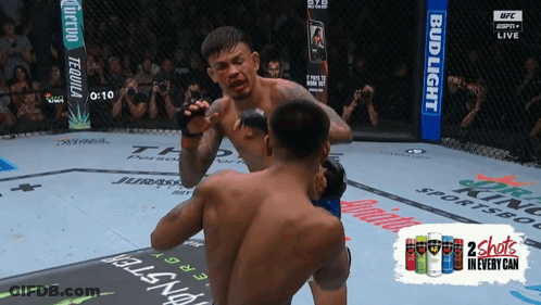Two Men Fighting In Boxing Ring GIF