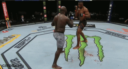 Two Men Fighting In Boxing Ring GIF