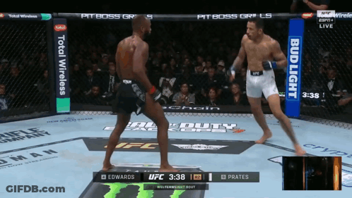 Two Men Fighting In Boxing Ring GIF